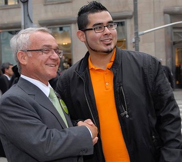 Joe Pantalone does some last minute get-out-the-vote activities, shaking hands with Juan Lemus, 22, a student in Toronto, at Yonge-Dundas Square on Oct. 25, 2010. (STACY BAILEY, Toronto Sun)