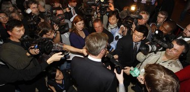 Jim Watson talks to a throng of media during his victory party in Ottawa Monday night.   Tony Caldwell/Ottawa Sun