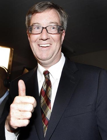 Jim Watson gives a thumbs up during his victory party in Ottawa Monday night.   Tony Caldwell/Ottawa Sun