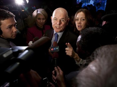 Ottawa Mayor Larry O'Brien, with his wife Colleen McBride (L) and communication advisor Jasmine MacDonnell (R), meet the media following his consolation speech following the municipal election. O'Brien was defeated by Jim Watson Monday, October 25, 2010. (ERROL MCGIHON/THE OTTAWA SUN)