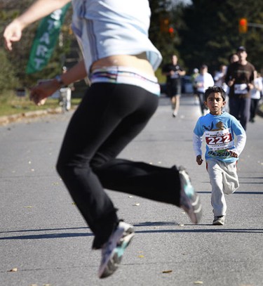 Oct 17/2010 The 2010 5K and 10K MADD Dash took place in Kanata Sunday. Hundreds of runners were out running and enjoying the warm fall weather. Vishva Prabhu watches someone dance at the finish line  Sunday.   Tony Caldwell/Ottawa Sun