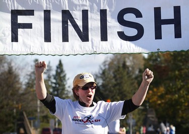 Oct 17/2010 The 2010 5K and 10K MADD Dash took place in Kanata Sunday. Hundreds of runners were out running and enjoying the warm fall weather. Jill Wanless celebrates at the finish line Sunday.   Tony Caldwell/Ottawa Sun