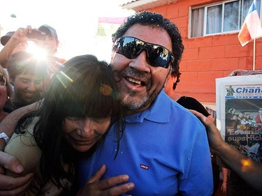 Chilean miner Luis Urzua embraces his wife Margarita at his house after being rescued from the San Jose mine, in Copiapo on Oct. 15, 2010. Chile's rescued miners headed home on Friday as heroes after an ordeal deep underground during which they drank oil-contaminated water and set off explosives in a desperate bid to alert rescuers. (REUTERS)
