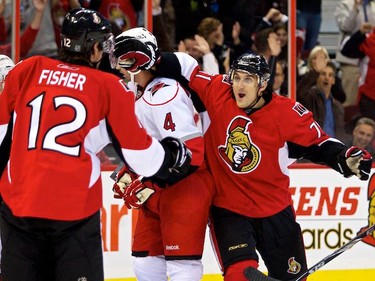 Ottawa Senators Nick Foligno heads to congratulate teammate Mike Fisher on his goal against the Carolina Hurricanes during first period action at Scotiabank Place. October 14,2010 (Errol McGihon/The Ottawa Sun)