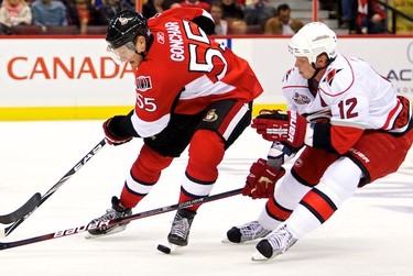 Ottawa Senators Sergei Gonchar is pursued by Carolina Hurricabnes Eric Staal during first period action at Scotiabank Place. October 14,2010 (Errol McGihon/The Ottawa Sun)