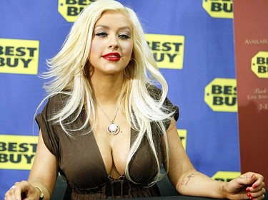 In this Feb. 5, 2008 file photo, Christina Aguilera attends an autograph session for her DVD "Back to Basics - Live and Down Under" in West Hollywood, California. TMZ quoted an unidentified source as saying that the pair had become "more like friends than husband and wife." (REUTERS)