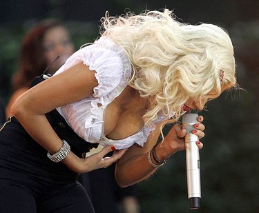 In this Aug. 18, 2006 file photo, Christina Aguilera performs on ABC's Good Morning America in New York's Bryant Park. Aguilera has filed divorce papers seeking to end her five-year marriage to music executive Jordan Bratman. (REUTERS)