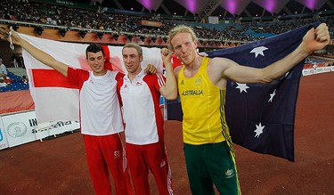 Gold medallist Steve Hooker of Australia (R), silver medallist Steven Lewis (L) and bronze medallist Max Eaves, both of England, celebrate after the men's pole vault finals at the Commonwealth Games in New Delhi on Oct. 11, 2010. (REUTERS)