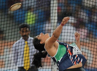 India's Seema Antil makes her throw during the women's discus finals at the Commonwealth Games in New Delhi on Oct. 11, 2010. (REUTERS)