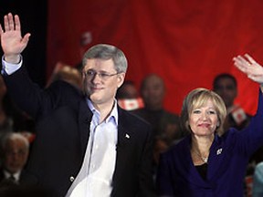 Prime Minister Stephan Harper and wife Laureen wave to supporters in Ottawa at a rally marking the fifth year of his time as Prime Minister of Canada, January 23, 2011. Chris Roussakis/QMI Agency