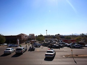 Law enforcement personnel work a crime scene where U.S Representative Gabrielle Giffords (D-AZ) was shot along with others at a Safeway in Tucson, Arizona on Jan. 8, 2011. Rep.   (REUTERS)