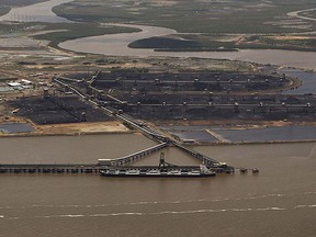 A coal ship waits to be loaded at the port in Gladstone, Queensland Jan. 2, 2011.  REUTERS/Daniel Munoz