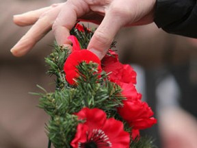 A poppy is placed on a wreath at a Remembrance Day ceremony at Valour Road and Sargent Avenue in this 2010 photo. (MARCEL CRETAIN/QMI Agency)