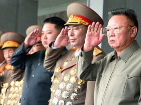 North Korea's leader Kim Jong-il (R) and Kim Jong-un (3rd R), vice-chairman of the Central Military Commission of the Workers' Party of Korea (WPK), watch a grand military parade to celebrate the 65th anniversary of the founding of WPK, in Pyongyang on Oct. 10, 2010. (REUTERS)