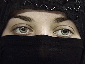 Should women be allowed to wear niqabs at citizenship ceremonies? (REUTERS/Khaled al-Hariri)