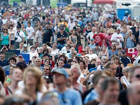 A huge crowd watches The Bacon Brothers perform at the Ottawa Bluesfest Thursday, July 8, 2010. Any event with more than 300 participants or guests would require a new permit if the city approves a proposed bylaw. (DARREN BROWN/QMI Agency)