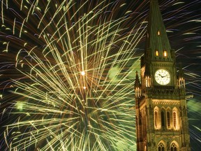 The traditional Canada Day fireworks show illuminated the Peace Tower. (DARREN BROWN/QMI Agency)