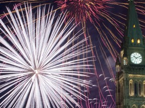 The traditional Canada Day fireworks show illuminated the Peace Tower Thursday night. (DARREN BROWN/QMI Agency)