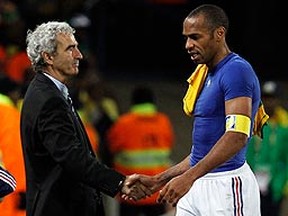 France's Thierry Henry shakes hands with head coach Raymond Domenech after a loss to South Africa in the 2010 World Cup. (REUTERS/Jorge Silva)