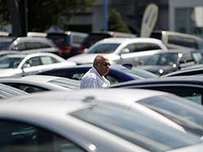 A potential car buyer looks at vehicles on a lot in Silver Spring, Maryland. (Reuters files)