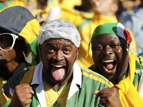 South African soccer fans cheer during the opening ceremony of the 2010 World Cup at Soccer City stadium in Johannesburg June 11, 2010. (Kai Pfaffenbach/REUTERS)