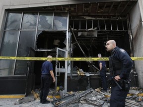 Ottawa Police investigate a fire bombing which took place at the Royal Bank on First Ave. in the Glebe early Tuesday morning. A witness told the Sun the firebomb was set in the bank's ATM kiosk. Ottawa police confirm several men were seen driving away from the scene just before the flames erupted at approximately 3:28 a.m.  Tony Caldwell/QMI Agency