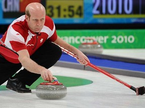 Kevin Martin of Canada throws a rock during the Olympic men's curling at the Vancouver Olympic Centre in Vancouver, B.C., on Monday, Feb. 22. (MARTIN CHEVALIER/QMI AGENCY)