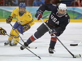 Lisa Chesson of the U.S. maneuvers the puck during their women's hockey play-offs semifinals game against Sweden at the Vancouver 2010 Winter Olympics on Monday, Feb. 22. (REUTERS/Scott Audette)