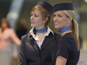 Porter Airlines flight attendants pose in the terminals lounge area Billy Bishop Toronto City Airport. (Jack Boland/QMI Agency)