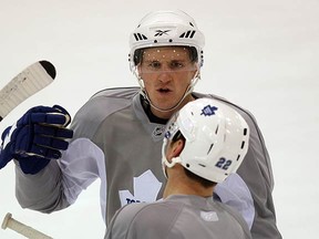 Phaneuf talks with Francois Beauchemin at Leafs practice at the ACC on Feb. 4, 2010. (CRAIG ROBERTSON, Toronto Sun)