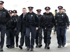 A symposium will examine ways members of the Ottawa Police can evolve the way they deal with the public on a day-to-day basis.  (ERROL MCGIHON/OTTAWA SUN)