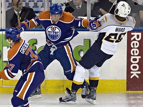 Edmonton Oilers Robert Nilsson holds up Nashville Predators Joel Ward, back in 2011. (EDMONTON SUN FILE)