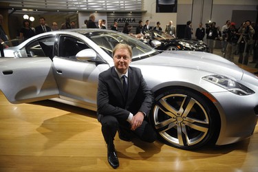 Henrik Fisker, Founder and CEO of Fisker Automotive, poses in front of the Fisker Karma following a news conference at the LA Auto show in Los Angeles December 3, 2009. REUTERS/Phil McCarten