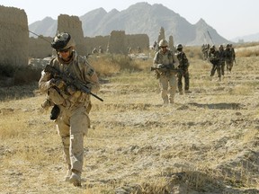 Canadian Forces on patrol in Afghanistan. (Photo by Master Corporal Matthew McGregor, Department of National Defence/Image Tech, JTFK Afghanistan, Roto 8)