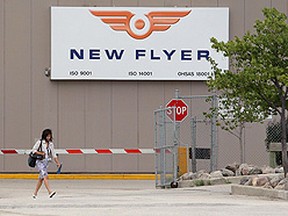 A worker leaves the New Flyer Industries plant in Transcona. (JASON HALSTEAD/Winnipeg Sun file photo)