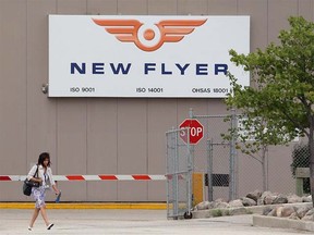 An employee leaves the New Flyer Industries plant in Transcona. The Winnipeg-based bus-maker has bought Alabama-based North American Bus Industries. (JASON HALSTEAD, Sun Media)