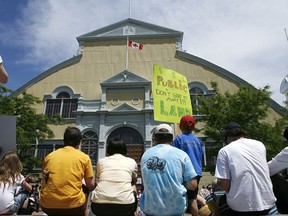 Protesters listen to speeches during a rally at Lansdowne Park Sunday. The Friends of Lansdowne Park want to keep Lansdowne a green space and public park.(ANDRE FORGET/Sun Media)