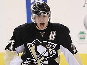 Penguins centre Evgeni Malkin celebrates his third goal of the game last night against the Hurricanes in a 7-4 win in Pittsburgh. The Penguins are two wins away to advancing to the Stanley Cup final for the second straight season. (Shaun Best/Reuters)