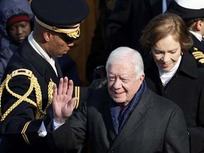 Former U.S. President Jimmy Carter (centre) and wife Rosalynn (right) arrive for the inauguration ceremony of Barack Obama as the 44th President of the United States, in Washington, Jan. 20, 2009. (Jim Young/REUTERS)