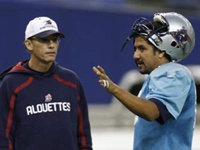 Getting ready for the Grey Cup Montreal Alouettes quarterback Anthony Calvillo (R) talks with coach Marc Trestman during the team's Grey Cup practice at Olympic Stadium in Montreal, November 21, 2008. The Alouettes will play the Calgary Stampeders in the CFL's 96th Grey Cup football game on Sunday. (REUTERS)