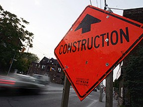 Construction signs like this one at Bathurst St. and Harbord St. will be sprouting up on hundreds of T.O., streets next year under proposed road repairs. (Sun Media File)