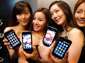 Models pose with the Samsung Galaxy S Android smartphone on June 8, 2010. Samsung Electronics Co overtook Apple Inc as the world's top smartphone maker in the July-September period with a 44% jump in shipments. (REUTERS FILE)