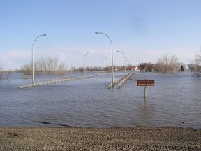Rising flood water from the Red River has backed up the Morris River, causing the closure of Highway 75 at Morris on April 25, 2011. This bridge over the Morris River was under at least a foot of water at the time. (Glen Hallick, QMI Agency files)