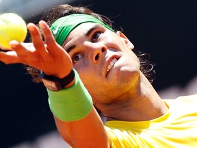 Rafael Nadal of Spain serves to his compatriot Feliciano Lopez during their match at the Rome Masters tennis tournament on May 12, 2011. (REUTERS/Max Rossi)