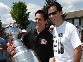 Ex-hockey player Doug Gilmour delivers the Stanley Cup to contest winner Kevin McNamara last year in North Gower. TONY CALDWELL/OTTAWA SUN/QMI AGENCY