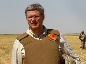 Canada's Prime Minister Stephen Harper visits Tarnak farms in Kandahar province May 30, 2011. Canadian government funded the construction of a dam which helped local farmers to cultivate wheat.   REUTERS/Yiorgos Karahalis   (AFGHANISTAN - Tags: AGRICULTURE MILITARY POLITICS)