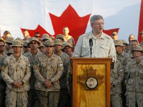 Prime Minister Stephen Harper delivers a speech to Canadian troops based at Kandahar Air Base on May 30, 2011. (REUTERS/Yiorgos Karahalis)