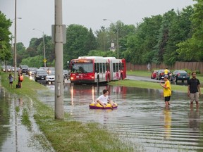 Aftermathof a brief but violent storm that swept through the Ottawa are in 2011.  The rain overwhelmed the storm drains on Orleans Blvd. and Beausejour Dr.
Photo by TODD LANGILLE