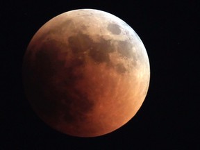 The moon is seen during a total lunar eclipse from Cairo on June 15, 2011. (REUTERS/Amr Abdallah Dalsh)