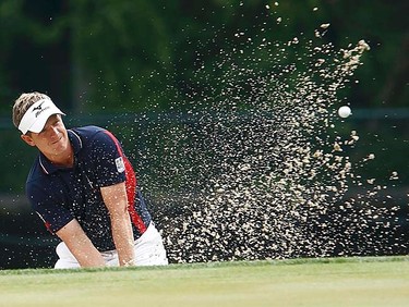 England's Luke Donald hits from a sand trap to the 18th green during the first round of the 2011 U.S. Open at Congressional Country Club in Bethesda, Maryland, Thursday, June 16, 2011. (REUTERS/Kevin Lamarque)